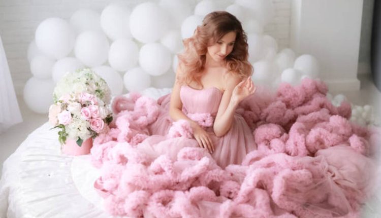 Show Off Your Feminine Side With This Pink Feather Dress